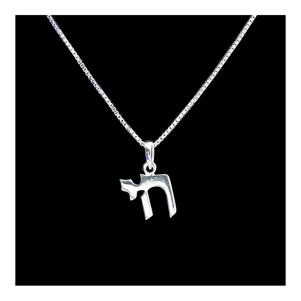 A sterling silver necklace featuring a Chai pendant on a box chain against a black background.
